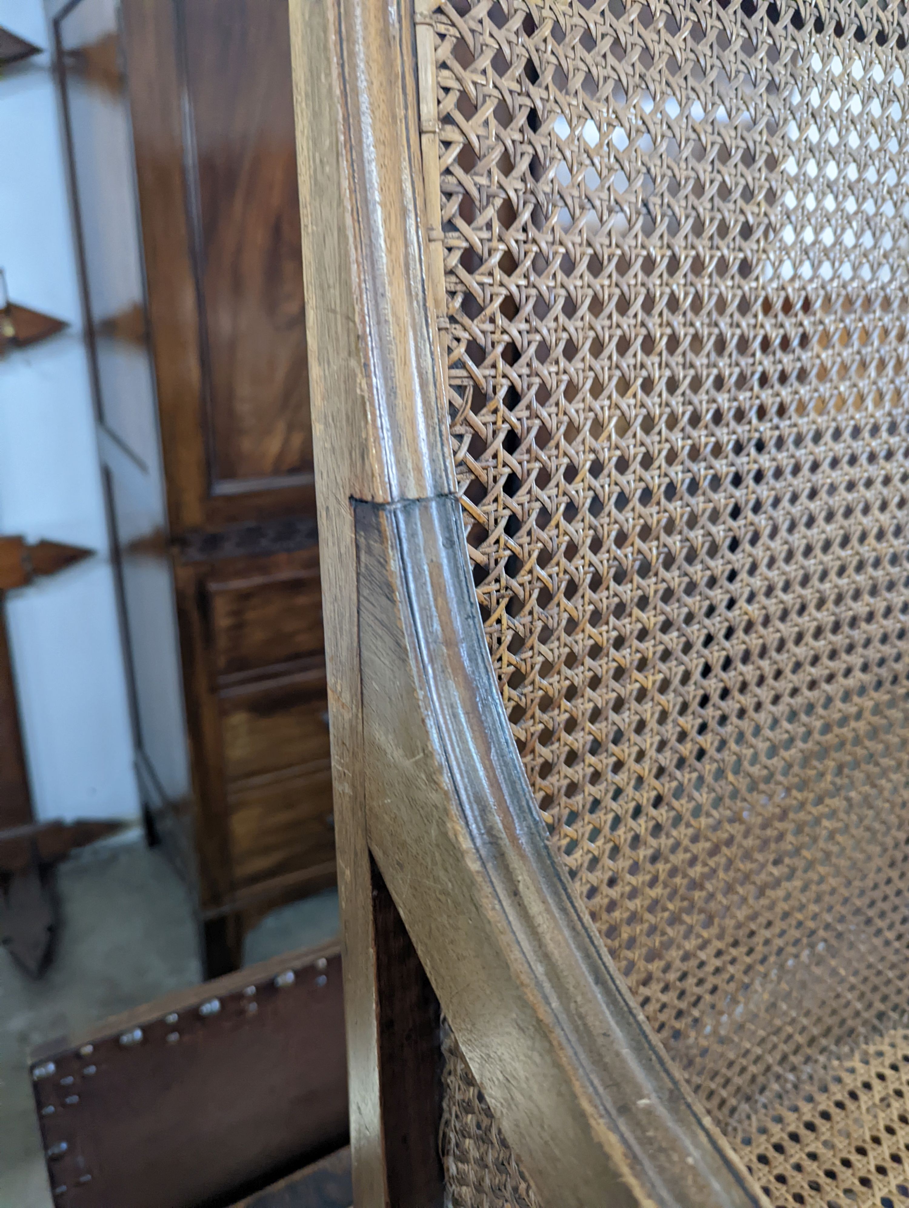A Regency style mahogany bergere armchair, width 59cm, depth 56cm, height 97cm